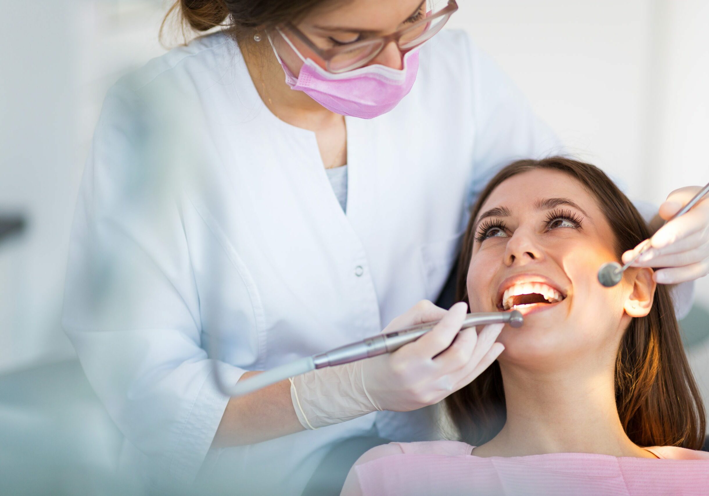 woman sits with an affordable dentist from west richland family dental located in rich land, wa